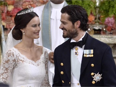 Sweden's Prince Carl Philip enjoys a sweet look with his new bride, Sofia Hellqvist at the altar during their wedding ceremony at the Royal Chapel in Stockholm Palace on June 13, 2015.