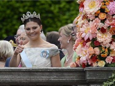 Sweden's Crown Princess Victoria gestures outside the Stockholm Palace after the wedding ceremony of Sweden's Crown Prince Carl Philip and Sofia Hellqvist on June 13, 2015.