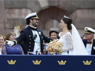 Sweden's Princess Sofia, right, and Sweden's Prince Carl Philip greet the crowds after their wedding ceremony at Stockholm Palace on June 13, 2015.