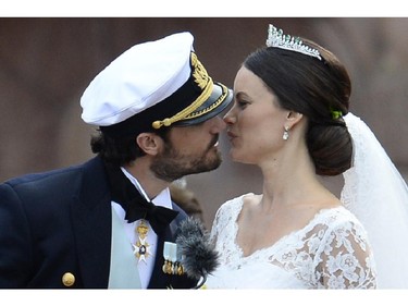Sweden's Princess Sofia, right, and Sweden's Prince Carl Philip kiss after their wedding ceremony at Stockholm Palace on June 13, 2015.