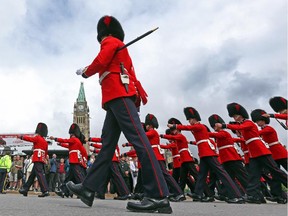 The Ceremonial Guard leave Parliament Hill after the first Changing of the Guard ceremony for the 2015 season today in Ottawa, June 29.