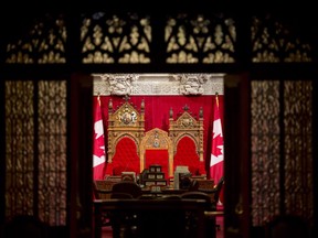 The thrones in the Senate Chamber are seen through the main entrance on Parliament Hill Wednesday May 22, 2013 in Ottawa.