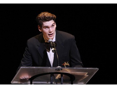 The winner(s) for Featured Actor In a Musical: Jacob Taylor, A. Y. Jackson Secondary School for The Addams Family: The New Musical Comedy, accept(s) their award, during the 10th annual Cappies Gala awards, held at the National Arts Centre, on June 07, 2015.