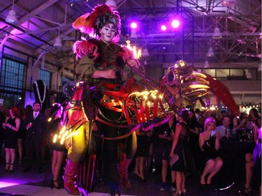 This colourful and engaging stilt puppeteer was part of the evening's dazzling entertainment at the Bash Noir party held at Lansdowne Park's Horticulture Building on Saturday, June 20, 2015.