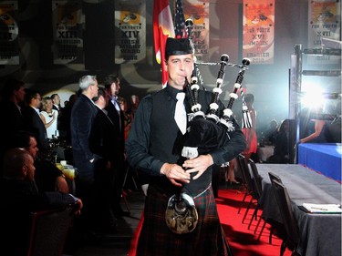 Piper Nico Gravel  and the Ottawa Police Colour Guards escorted singer Kellylee Evans to the ring for her performance of the American and Canadian national anthems during the Ringside for Youth XXI benefit for the Boys and Girls Club of Ottawa, held at the Shaw Centre on Thursday, June 11, 2015.