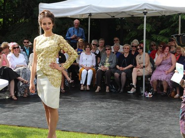 This model from Angie's Models & Talent holds her pose for a photographer at the Sukhoo Sukhoo Fashion Show, presented during the annual garden party for Cornerstone Housing for Women, on Sunday, June 7, 2015, at the official residence of the Irish ambassador.