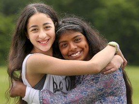 Haley Miller, left, and Sumaya Al-Idrissi, both 12, at the Day of Cultural Understanding at Charles H. Hulse Public School: 'It doesn't really matter what religion you are, we can all be friends.'