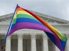 A rainbow flag is flown outside the Supreme Court in Washington, DC on June 26, 2015 after its historic decision on gay marriage.