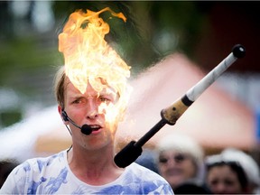 Yoshi Chladny a busker had the crowd entertained while he juggled fire at Westfest Saturday June 13, 2015. The weekend festival  took over the streets of Westboro.