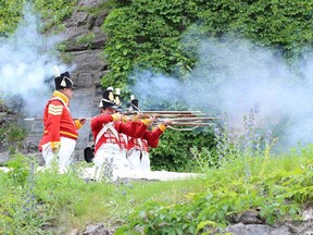 Re-enactors hold musketry practice for the 100th Regiment of Foot and mee visitors at the Rideau Canal NHS Ottawa Locks during the Soldiers' Field Day on June 27.