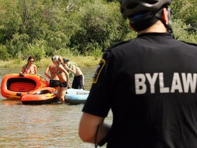 In this 2009 file photo, a group of rafters are forced off the Elbow river at Sandy Beach in Alberta because they had no lifejackets. (Photo by Lorraine Hjalte/Calgary Herald)