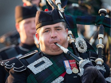 A piper marches on as the annual Fortissimo‚ a free military and musical performance on Parliament Hill, took place took place on Thursday, July 23, 2015.
