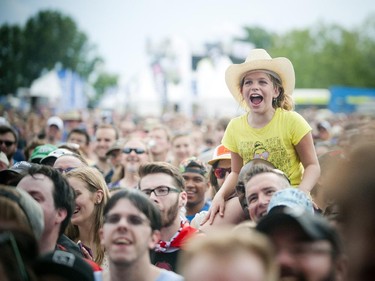 A young fan is excited to watch the "Weird Al" Yankovic performance on the Claridge Homes Stage Sunday July 19, 2015 the last night of RBC Ottawa Bluesfest.