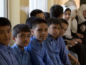 110702-N-8090G-005 MAZAR-E SHARIF, Afghanistan (July 2, 2011) Afghan Children attend a Ribbon cutting ceremony for the new dormitory at the Teacher Training College in Mazar-e Sharif. The dormitory features full living facilities and enough space to house up to 300 male and female students. The new college is a beacon of hope for raising the quality of future education in Afghanistan. Its construction was made possible through the German Development Corporation with funding from the KfW World Bank Group, Federal Republic of Germany. The college and dormitory are only two of many projects supporting the transition of socio-economic development to the Government of the Islamic Republic of Afghanistan. (U.S. Navy photo by Mass Communication Specialist 2nd Class Nicholas A. Garratt/Released)