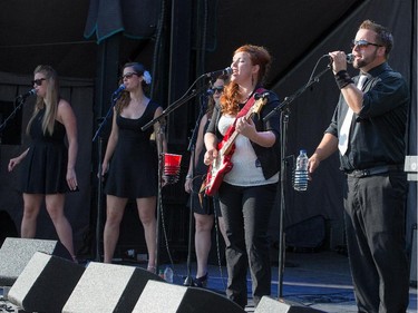 Ben and Angie Russell (from right) and their back up singers of Bluestone & the Memphis Moonshine on the Monster Energy Stage as day 8 of the RBC Ottawa Bluesfest gets underway at the Canadian War Museum.