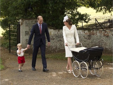 Prince George of Cambridge (L) his mother, Britain's Catherine, Duchess of Cambridge (R), pushing her daughter Princess Charlotte of Cambridge in her pram, and father Prince William, Duke of Cambridge (2nd L), leave Charlotte's Christening at St. Mary Magdalene Church in Sandringham, England, on July 5, 2015. Britain's baby Princess Charlotte was christened on Sunday in her second public outing since her birth nine weeks ago to proud parents Prince William and his wife Kate. The low-key ceremony took place in a church on the country estate of great grandmother Queen Elizabeth II.
