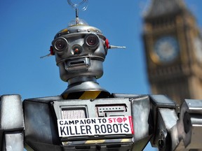 A file photo taken on April 23, 2013 shows a mock "killer robot" pictured in central London during the launching of the Campaign to Stop "Killer Robots," which calls for the ban of lethal robot weapons that would be able to select and attack targets without any human intervention.