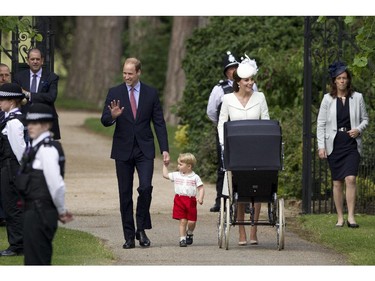 Britain's Prince William, Kate the Duchess of Cambridge, their son Prince George and daughter Princess Charlotte in a pram arrive for Charlotte's Christening at St. Mary Magdalene Church in Sandringham, England, Sunday, July 5, 2015.