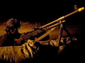 English/Anglais
LG2006-0612d
21 August 2006
Shilo, Mb

Shilo - Private Cameron Smith takes up position behind the C6 General Purpose Machine Gun (GPMG) next to the front gate. Pte Smith is a candidate on the Soldier Qualification (SQ) course.
82 Army Reserve recruits from Manitoba and North western Ontario on the Soldier Qualification (SQ) course, deployed to Canadian Forces Base Shilo for their final exercise.  The SQ course covered living in the field, defensive routine, reconnaissance patrols, section attacks, setting up a Forward Operating Base (FOB), refugees, insurgents, Improvised Explosive Devices (IED).
Photo: Cpl Bill Gomm

French/Français
LG2006-0612d
21 août 2006
Shilo (Manitoba)

Shilo – Le Soldat Cameron Smith prend position derrière une mitrailleuse polyvalente (MP) C6, près de la porte principale. Le Sdt Smith est l’un des stagiaires du cours de qualification de soldat (QS).
Quatre-vingt-deux recrues de la Réserve de l’Armée de terre orig