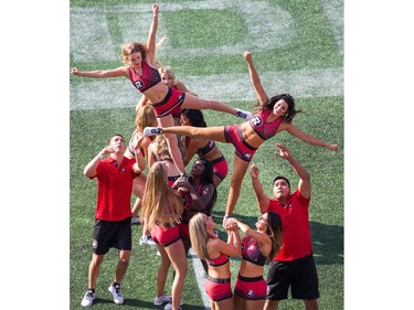 Cheerleaders practice their routines.