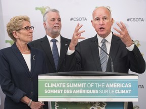 California Governor Jerry Brown, right, speaks to reporters with Ontario Premier Kathleen Wynne, left, and Quebec Premier Philippe Couillard at the Climate Summit of the Americas in Toronto on Wednesday, July 8, 2015.