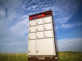A community mail box for Canada Post sits next to a construction site in Auburn Bay in Calgary on Monday, July 6, 2015.