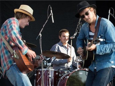 Dave Lang, left, Chris Petersen (on drums) and Scott Stanton of the band Current Swell.