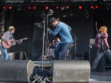 Dave Lang, left, Scott Stanton, centre, Chris Petersen (on drums) and Ghosty Boy of the band Current Swell on the Canadian Stage.