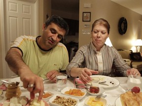 Demir and Nurcan Topcuoglu munch on cheese, apricots and walnus during suhoor, an early morning meal that takes place during Ramadan, the 30-day Islamic celebration observed by tens of thousands of Muslims scattered across the Ottawa-Gatineau.