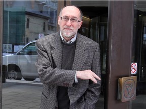 Denis Rancourt exits the Elgin St. courthouse in this May 2014 file photo.