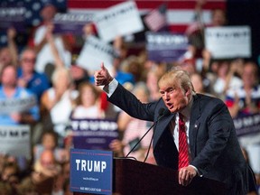 Donald Trump addresses supporters during a political rally at the Phoenix Convention Center on July 11, 2015.