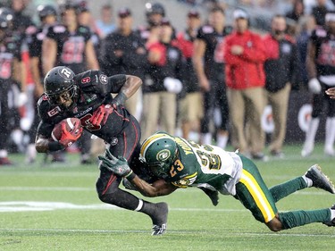 Ernest Jackson, left, of Ottawa dashes for the end zone but is caught by Edmonton's Marcell Young at the end of the first half.