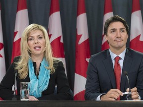 Former Conservative MP Eve Adams (left) is joined by Liberal Leader Justin Trudeau as she announces in Ottawa on Monday, Feb. 9, 2015 that she is leaving the Conservative Party to join the Liberal Party of Canada.