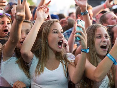 Fans cheer on Hoodie Allen on the Claridge Homes Stage as day 2 of the RBC Ottawa Bluesfest continues at the Canadian War Museum.  Assignment - 121065 Photo taken at 20:05 on July 9. (Wayne Cuddington / Ottawa Citizen)