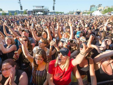 Fans enjoy Dallas Smith on the Bell Stage as day 8 of the RBC Ottawa Bluesfest gets underway at the Canadian War Museum.