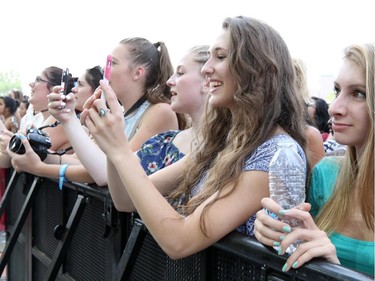 Fans enjoy various concerts at RBC Ottawa Bluesfest 2015 in Ottawa on July 12, 2015.