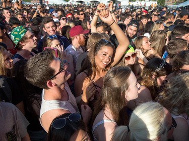 Fans of Canadian-born, Brooklyn-based pop singer Kiesza dance along with her while she performs on the Bell Stage.