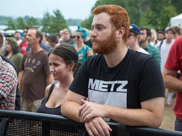 Fans of the band Metz watch them perform on the Canadian Stage.