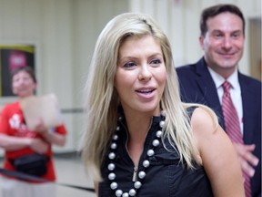 Former Conservative MP Eve Adams, left, is seen with rival Marco Mendicino as Liberals chose a candidate to represent them in the Toronto riding of Eglinton-Lawrence on Sunday, July 26, 2015.