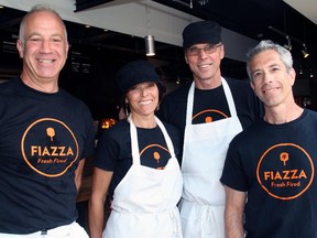 From left, co-owner David Sugarman with Kelly Cameron and her husband, Ottawa Senators head coach Dave Cameron, and co-owner Steve Lesh at the Fiazza Fresh Fired pizza shop in the ByWard Market on Sunday, July 5, 2015, helping to raise money for the Ottawa Rotary Home.