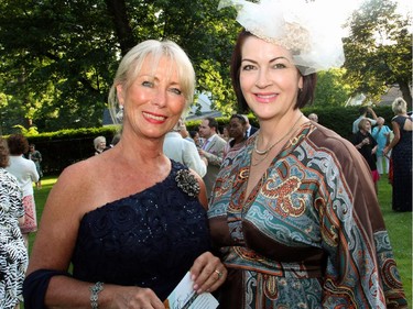 From left, Earlene's House of Fashion volunteer model Gail Carroll with guest Mary O'Keefe at the 20th Annual Garden Party for Opera Lyra Ottawa, held in Gatineau at the official residence of the Italian ambassador on Wednesday, July 8, 2015.