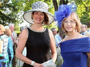 From left, volunteer model Janet Wilson, editor of Ottawa Citizen Style magazine, with Earlene Hobin, owner of Earlene's House of Fashion, at the 20th Annual Garden Party for Opera Lyra Ottawa, hosted by the Italian ambassador and his wife at their official residence in Gatineau on Wednesday, July 8, 2015.