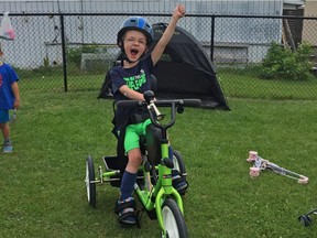 Mason Moffat Brozincevic rides his new adaptive bicycle. Children at Limoges Child Care wanted to help out with the cost of the bike, so they held a fundraiser.