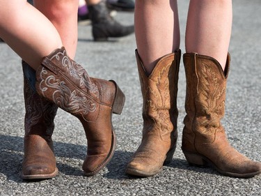 Girls in cowboy boots as day 2 of the RBC Ottawa Bluesfest features a country and western theme at the Canadian War Museum.