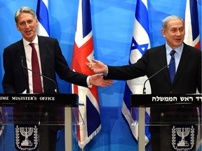 British Foreign Secretary Philip Hammond (L) holds a press conference with Israeli Prime Minister Benjamin Netanyahu at the latter's office in Jerusalem on July 16, 2015, following a meeting to discuss the recent nuclear deal between major powers and Iran.