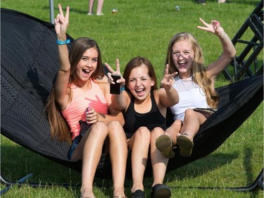 Jaslyn Beairsto, 14, Katie Fuller, 16, and Bailey Smith, 15, try out one the hammocks on site.