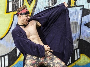 Jason 'Thrust' McNeely shows off some of his air guitar skills in Pinecrest Park on Thursday. Canada's air guitar champion, is heading to the international competition in Finland.