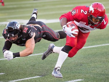 Jordan Verdone, left, misses the tackle on Tim Brown early in the first quarter.