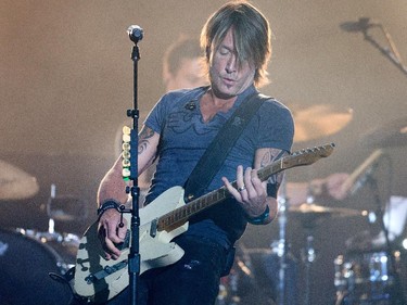 Keith Urban on the Bell Stage as day 8 of the RBC Ottawa Bluesfest gets underway at the Canadian War Museum. Assignment - 121070 Photo taken at 21:30 on July 16. (Wayne Cuddington / Ottawa Citizen)