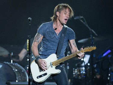 Keith Urban on the Bell Stage as day 8 of the RBC Ottawa Bluesfest gets underway at the Canadian War Museum. Assignment - 121070 Photo taken at 21:29 on July 16. (Wayne Cuddington / Ottawa Citizen)